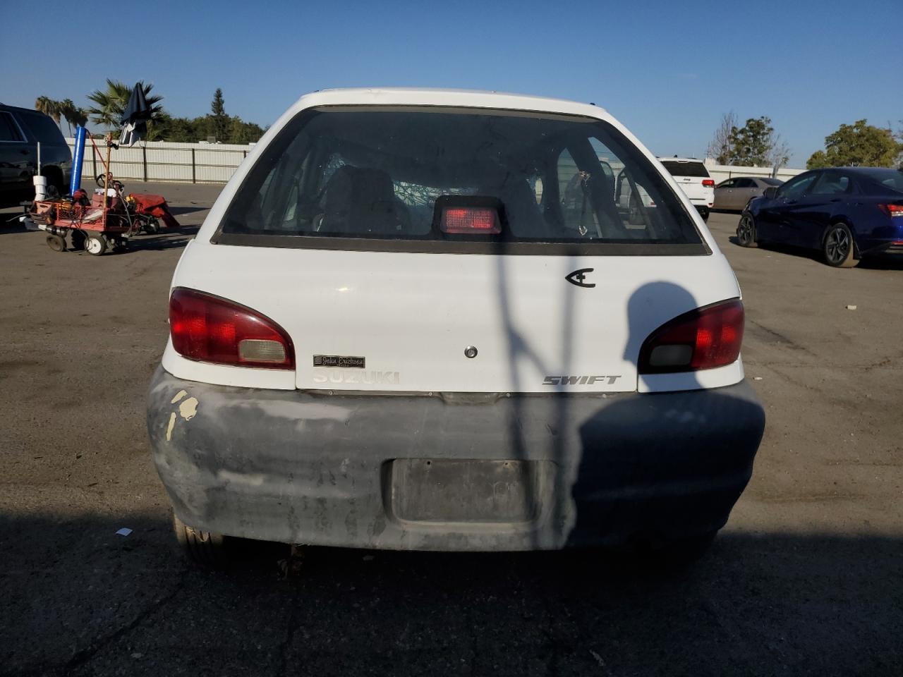 1999 Suzuki Swift VIN 2S2AB21H7X6601864 Copart auction photo, front end / top/roof damage thumbnail 6