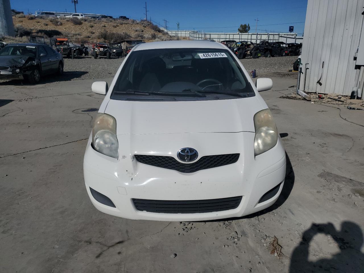 2009 Toyota Yaris VIN JTDKT903895258569 Copart auction photo, front end damage thumbnail 5