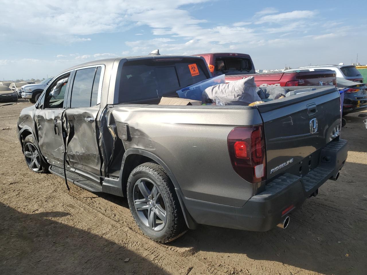 2022 Honda Ridgeline VIN 5FPYK3F74NB029701 Copart auction photo, all over damage thumbnail 2