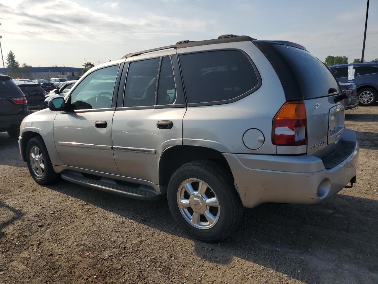 2007 GMC Envoy VIN 1GKDT13S472232289 Copart auction photo, rear end / missing/altered vin damage thumbnail 2