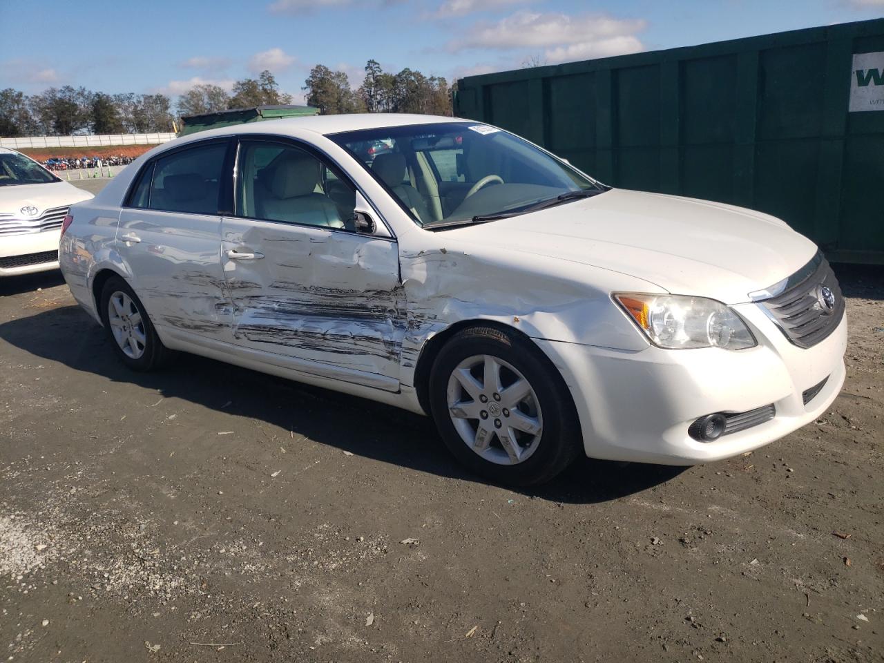 2010 Toyota Avalon VIN 4T1BK3DB8AU360669 Copart auction photo, side / front end damage thumbnail 4