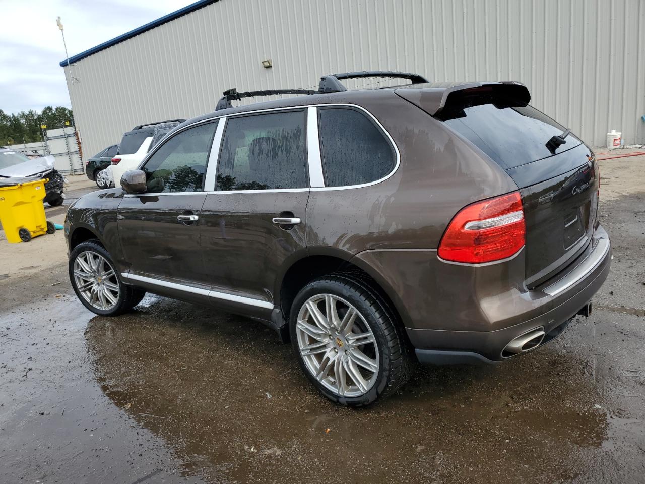 2010 Porsche Cayenne VIN WP1AA2APXALA07108 Copart auction photo, side / rear end damage thumbnail 2