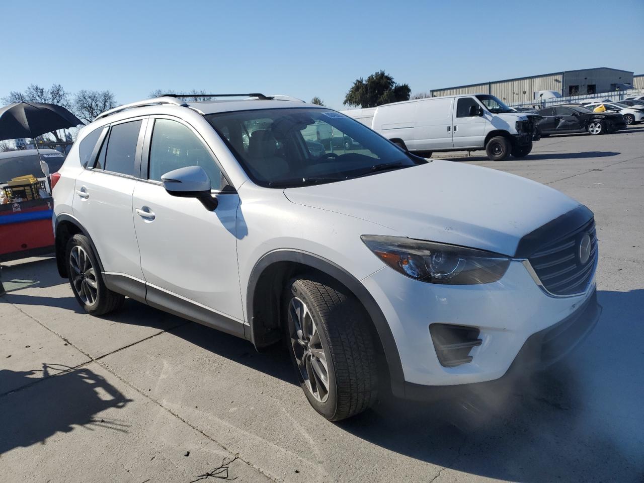 2016 Mazda CX-5 VIN JM3KE4DY2G0818428 Copart auction photo, front end damage thumbnail 4