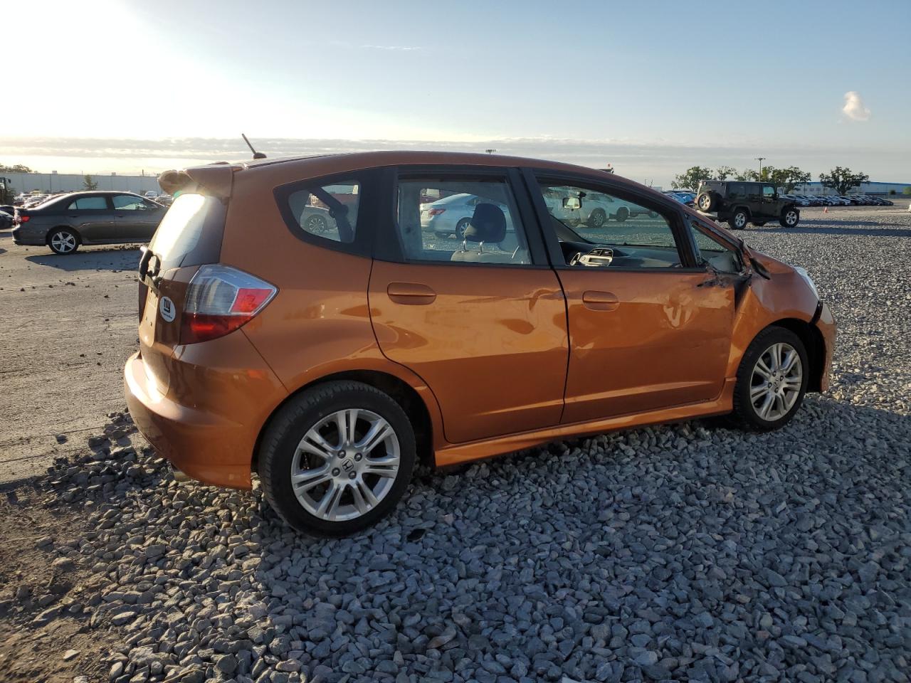 2010 Honda Fit VIN JHMGE8H41AC016227 Copart auction photo, side / front end damage thumbnail 3