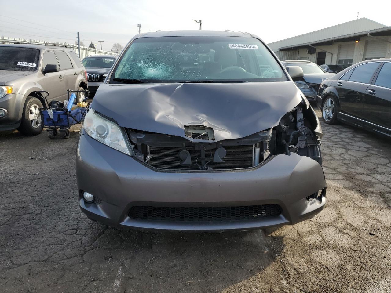 2012 Toyota Sienna VIN 5TDYK3DC3CS179851 Copart auction photo, front end / side damage thumbnail 5