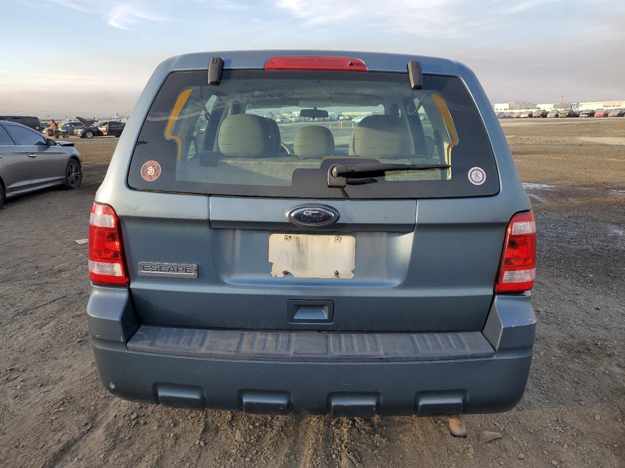 2010 Ford Escape VIN 1FMCU0C79AKD46351 Copart auction photo, all over damage thumbnail 6