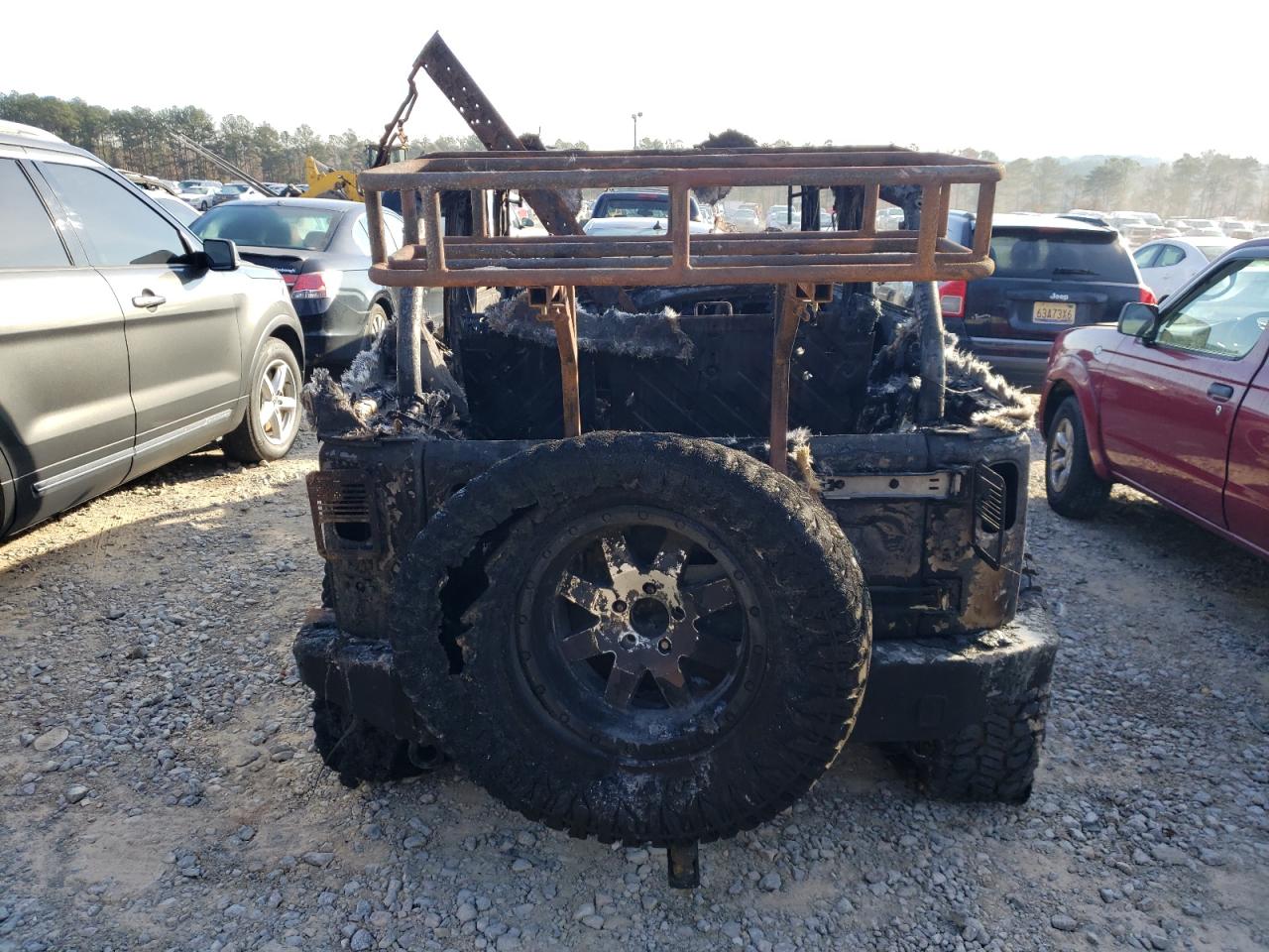 2016 Jeep Wrangler VIN 1C4BJWEG7GL142501 Copart auction photo, burn damage thumbnail 6
