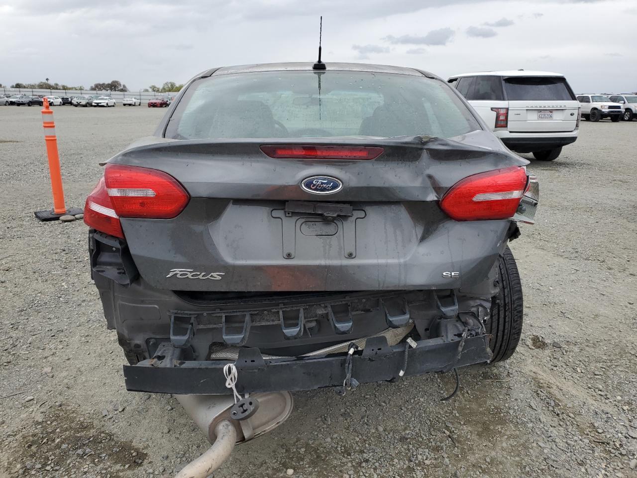 2016 Ford Focus VIN 1FADP3F25GL329217 Copart auction photo, all over damage thumbnail 6