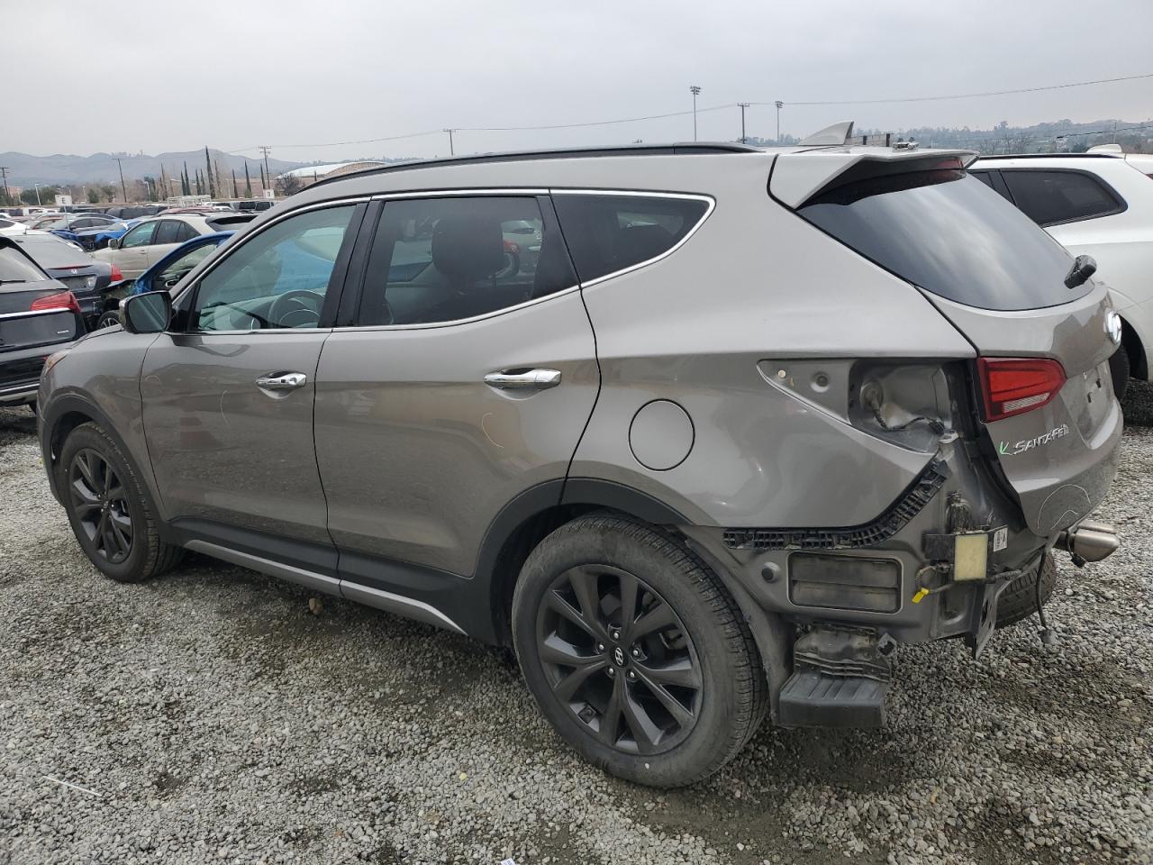 2018 Hyundai Santa Fe VIN 5NMZW4LA6JH102633 Copart auction photo, rear end / side damage thumbnail 2