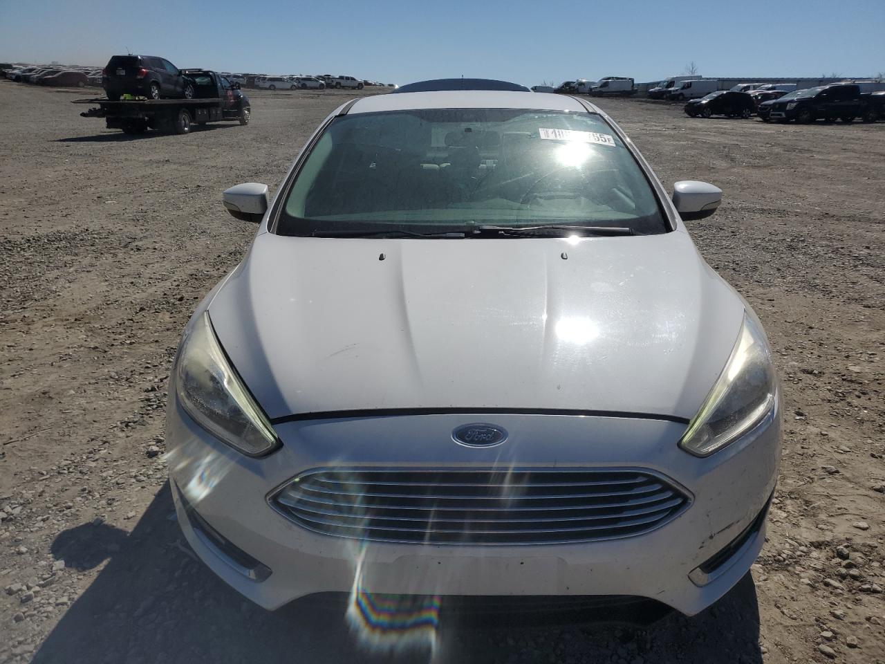 2016 Ford Focus VIN 1FADP3J29GL220363 Copart auction photo, rear end damage thumbnail 5