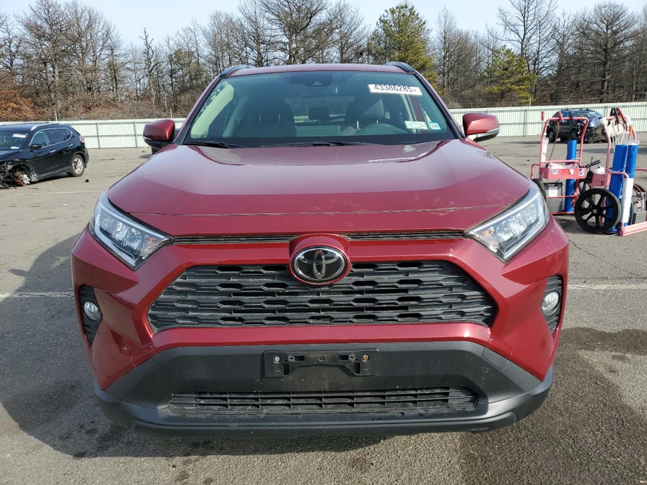 2019 Toyota RAV 4 VIN JTMP1RFV5KD019349 Copart auction photo, side / minor dent/scratches damage thumbnail 5