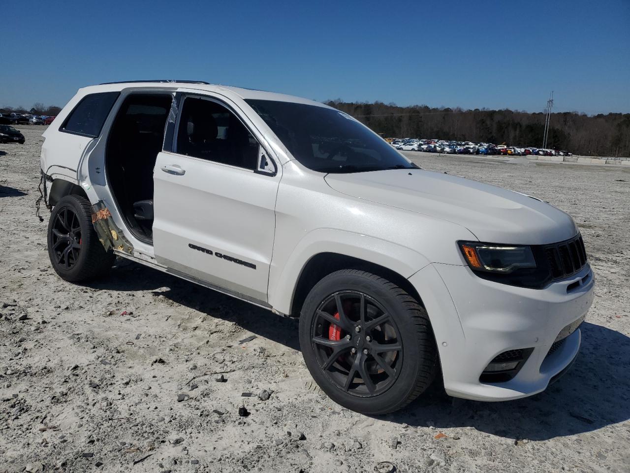 2019 Jeep Grand Cherokee VIN 1C4RJFDJ5KC801325 Copart auction photo, rear end / side damage thumbnail 4