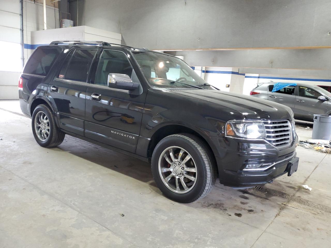 2015 Lincoln Navigator VIN 5LMJJ2JT9FEJ04044 Copart auction photo, top/roof damage thumbnail 4