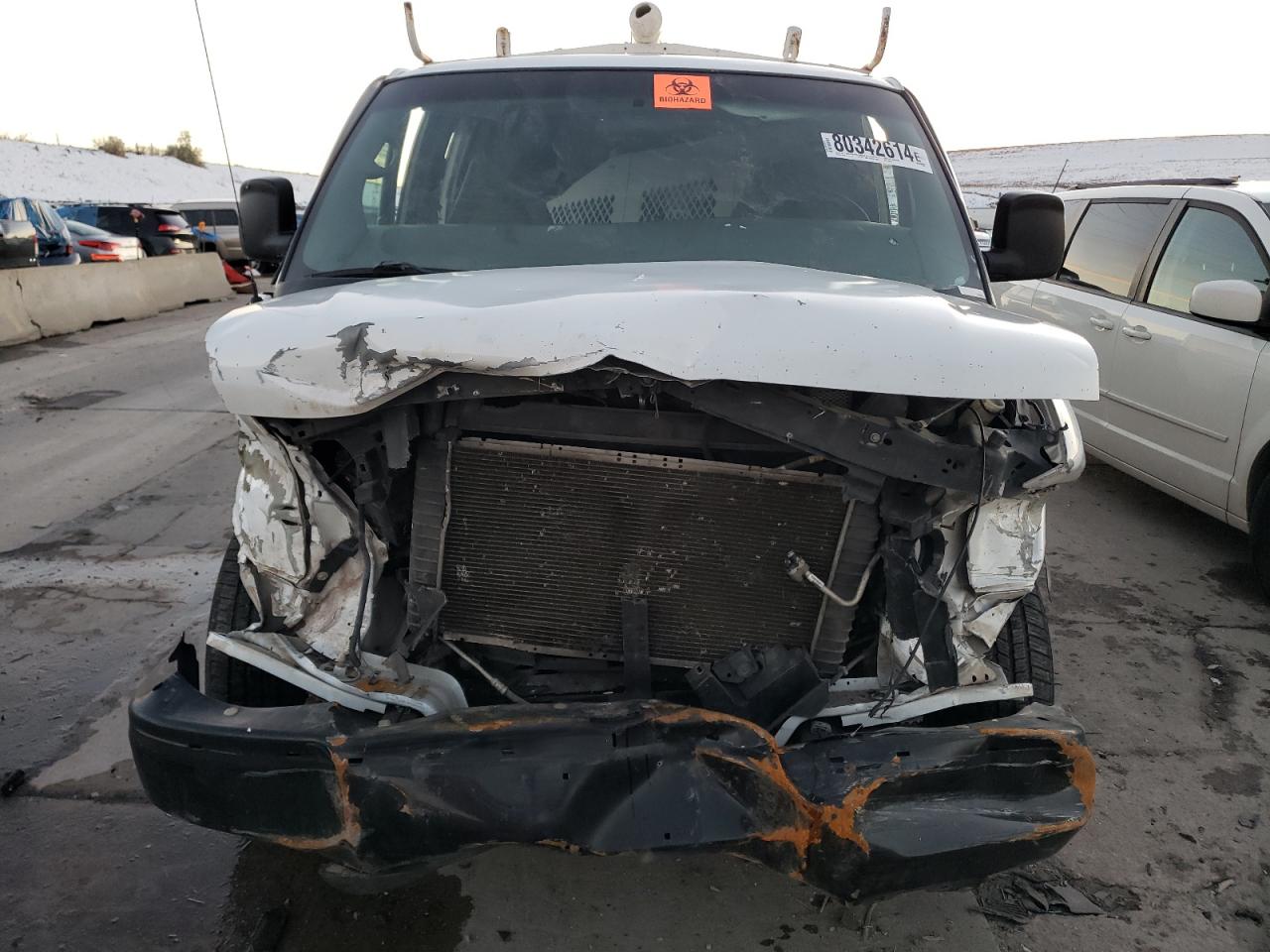 2009 Chevrolet Express VIN 1GCFG15X691143561 Copart auction photo, front end / hail damage thumbnail 5