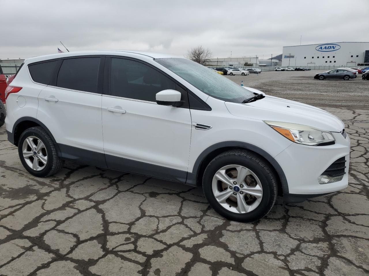2016 Ford Escape VIN 1FMCU9GX1GUB40727 Copart auction photo, side / minor dent/scratches damage thumbnail 4