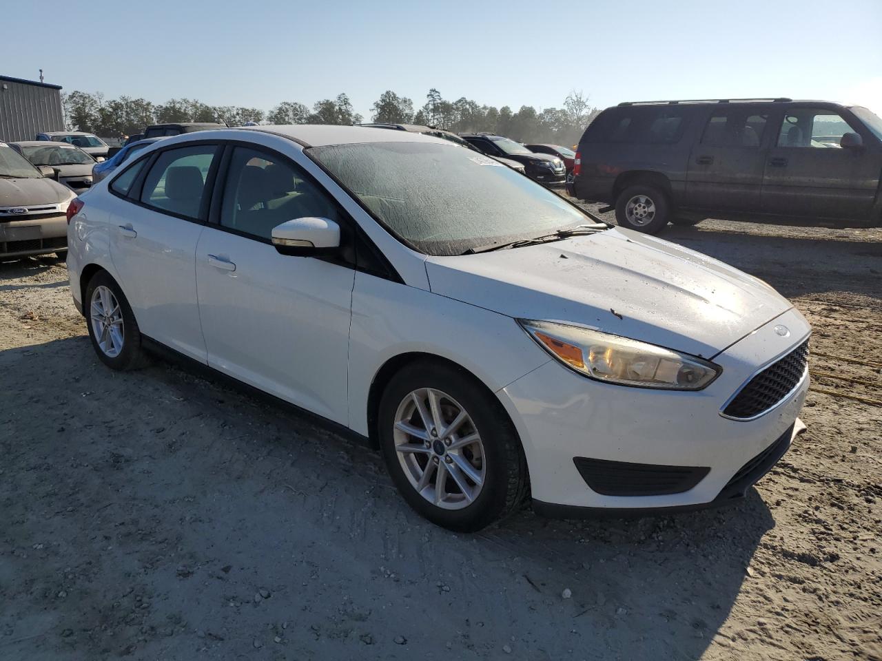 2015 Ford Focus VIN 1FADP3F22FL330498 Copart auction photo, water/flood damage thumbnail 4