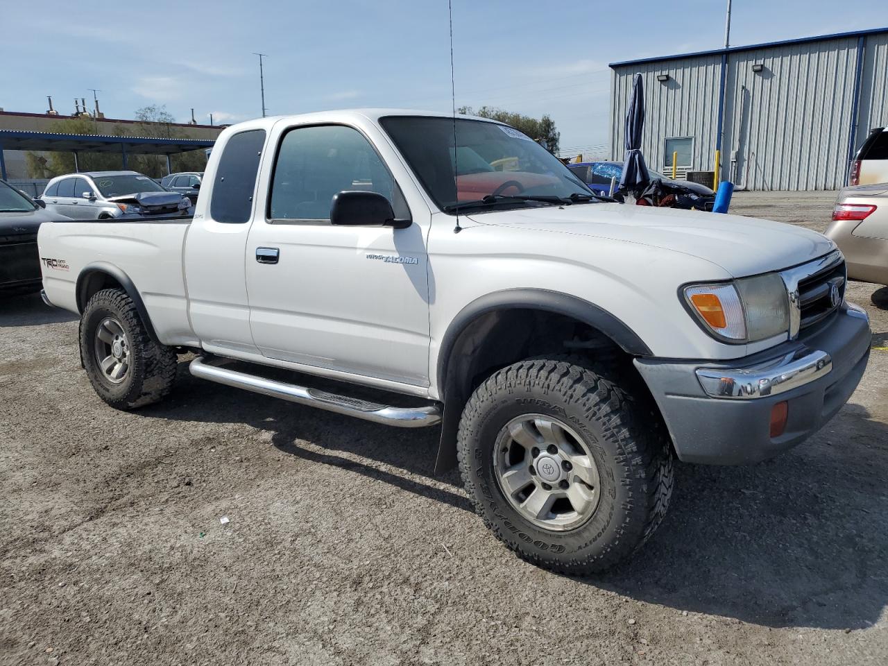 1999 Toyota Tacoma VIN 4TASN92N3XZ529595 Copart auction photo, side / rear end damage thumbnail 4