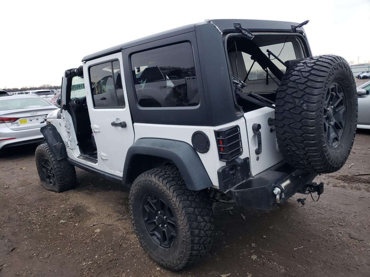 2016 Jeep Wrangler VIN 1C4BJWDG0GL302946 Copart auction photo, all over damage thumbnail 2