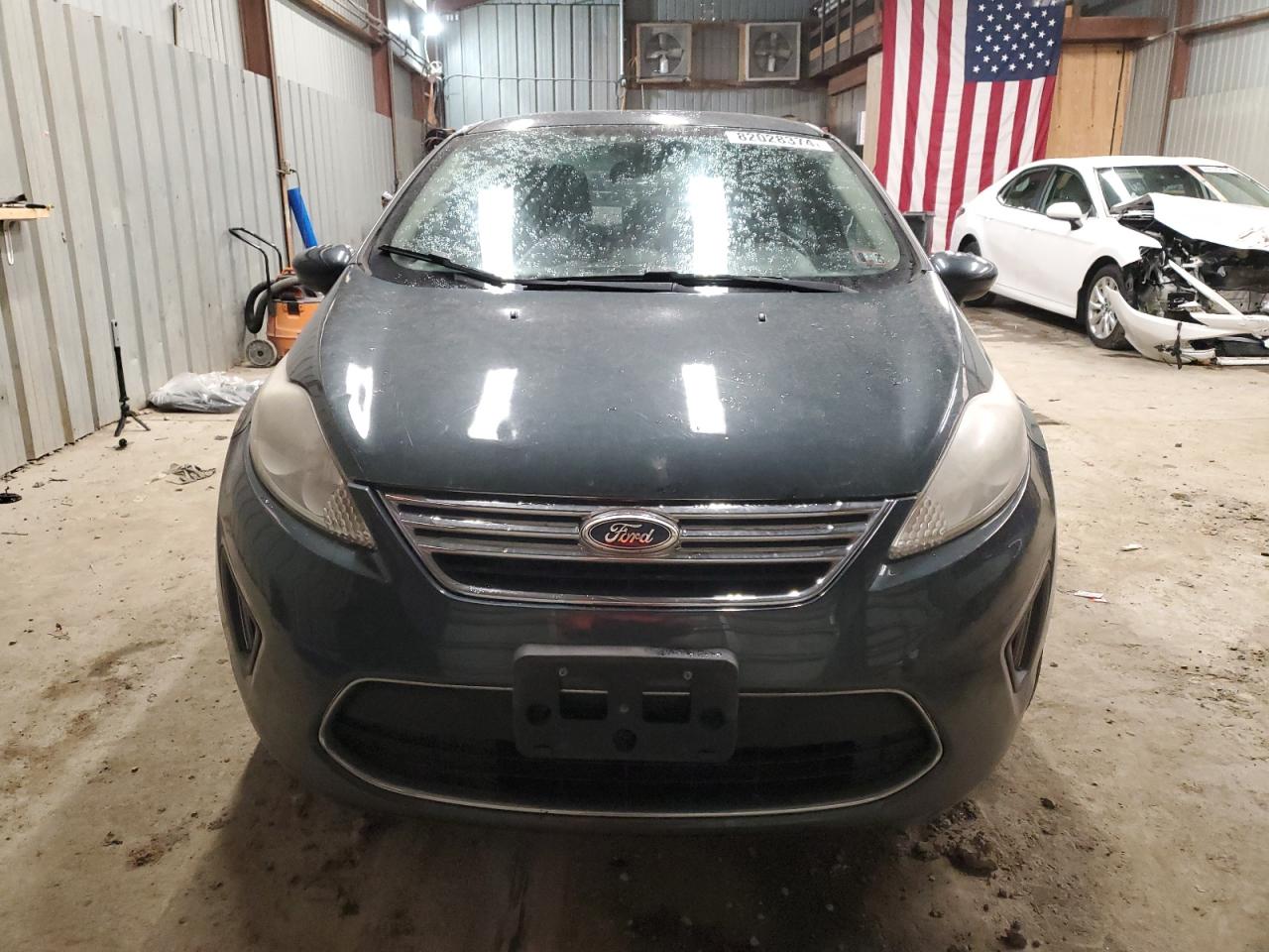 2011 Ford Fiesta VIN 3FADP4BJ6BM137332 Copart auction photo, rear end damage thumbnail 5