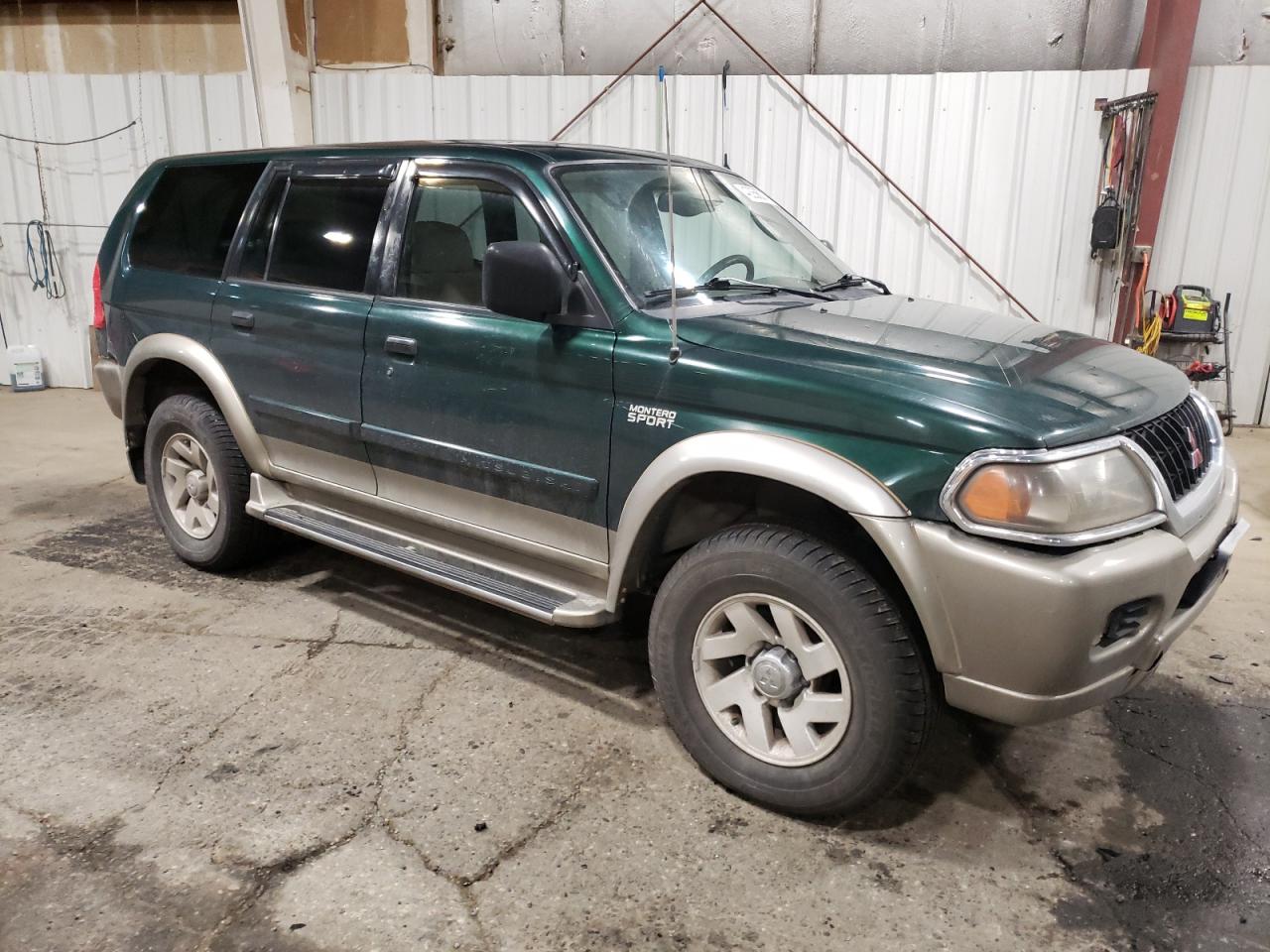 2000 Mitsubishi Montero VIN JA4MT31H2YP811973 Copart auction photo, rear end / front end damage thumbnail 4