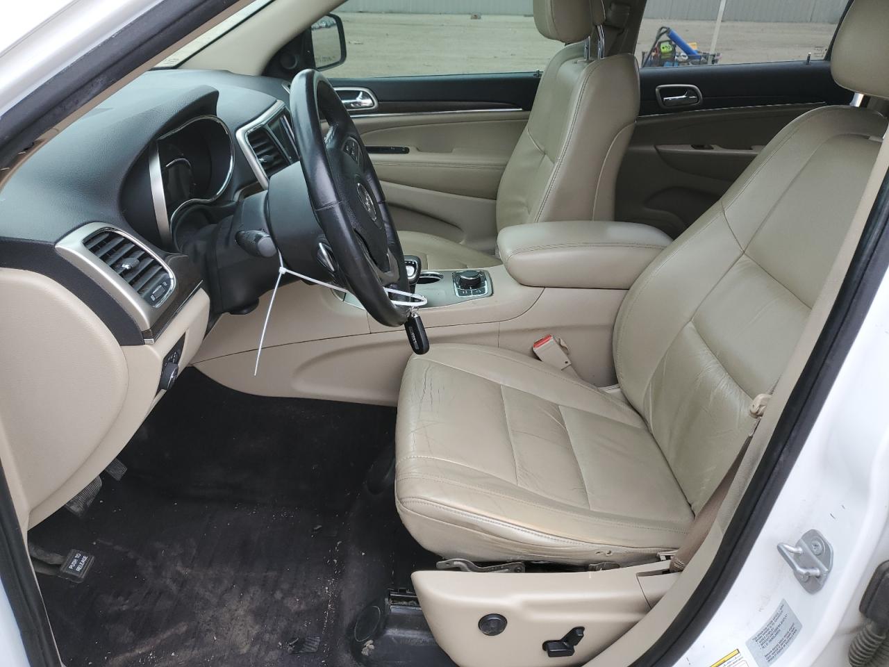 2015 Jeep Grand Cherokee VIN 1C4RJFBG1FC229585 Copart auction photo, side / undercarriage damage thumbnail 7