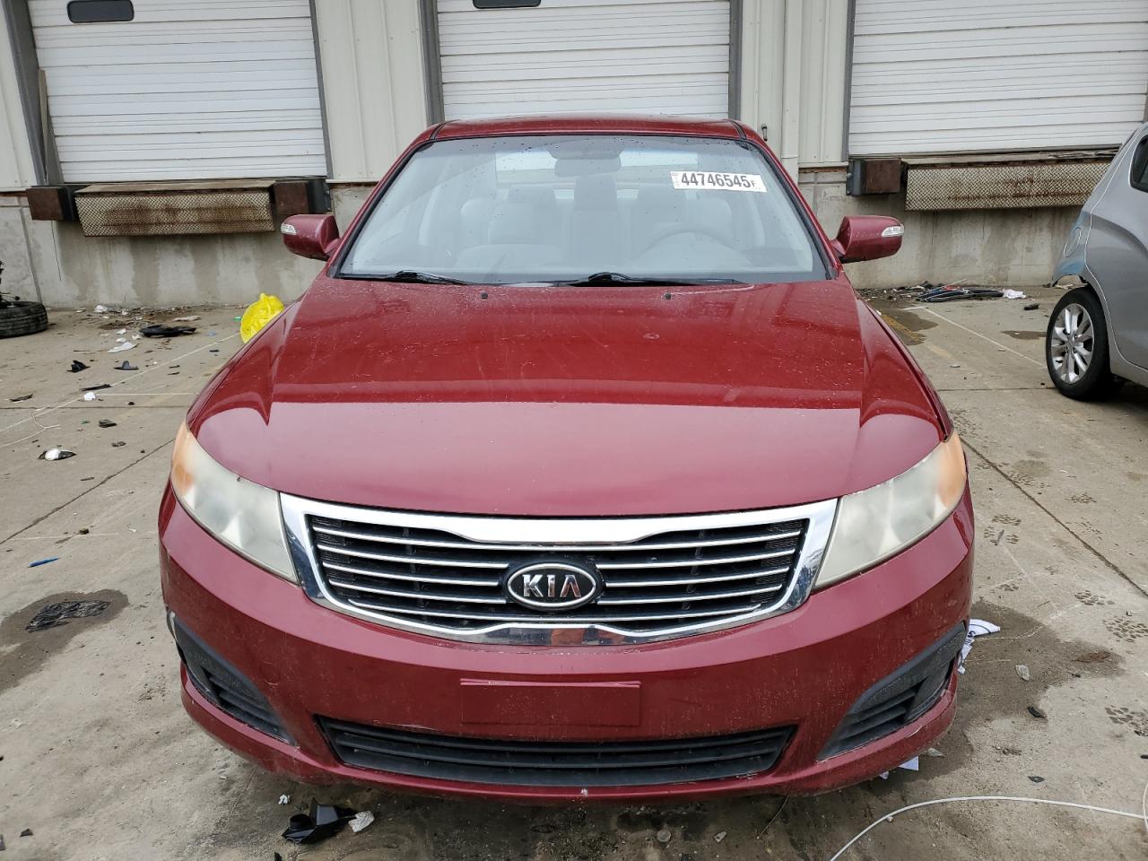 2009 KIA Optima VIN KNAGE228895282092 Copart auction photo, front end / side damage thumbnail 5