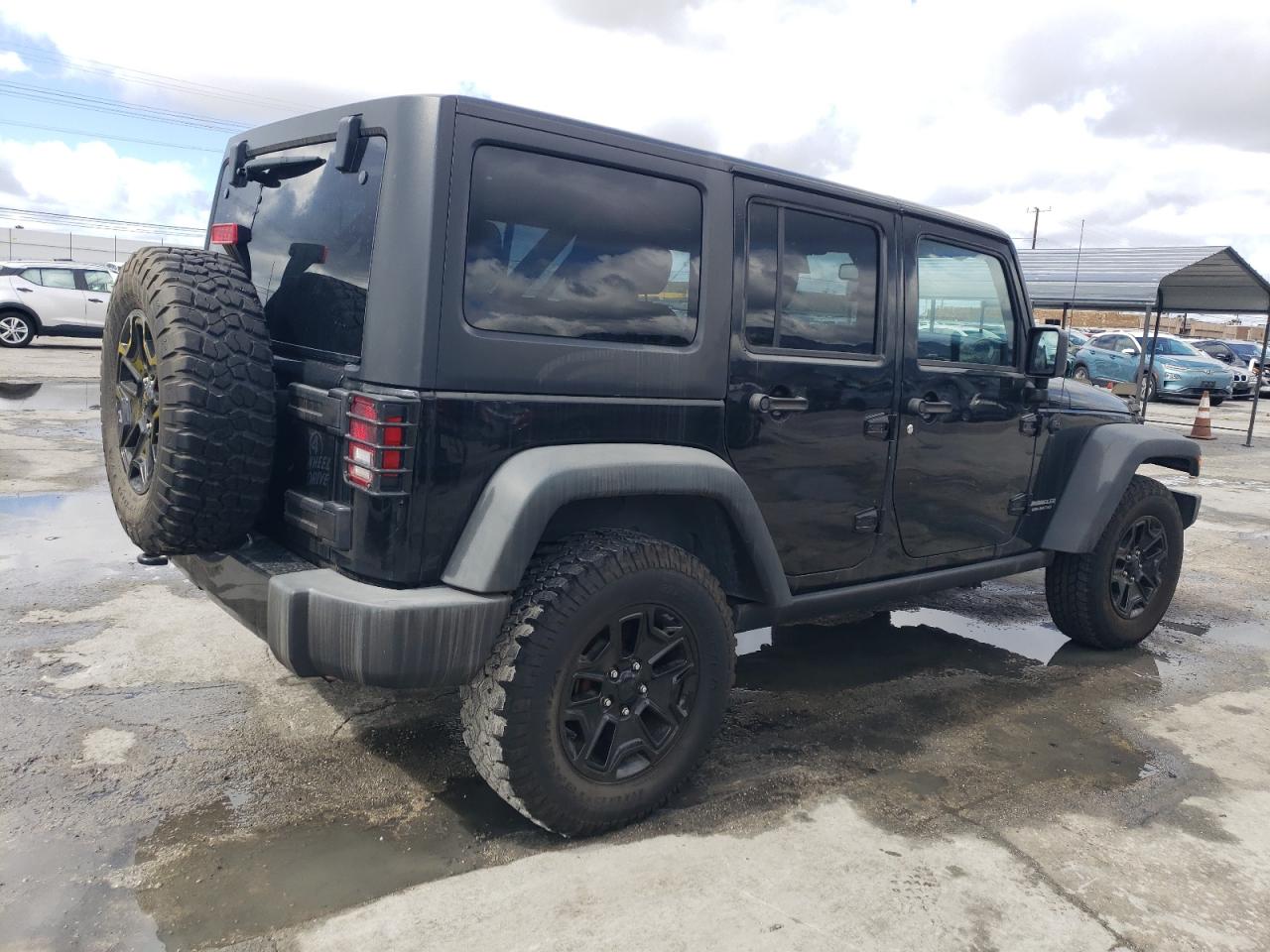 2016 Jeep Wrangler VIN 1C4BJWDG3GL301788 Copart auction photo, vandalism damage thumbnail 3