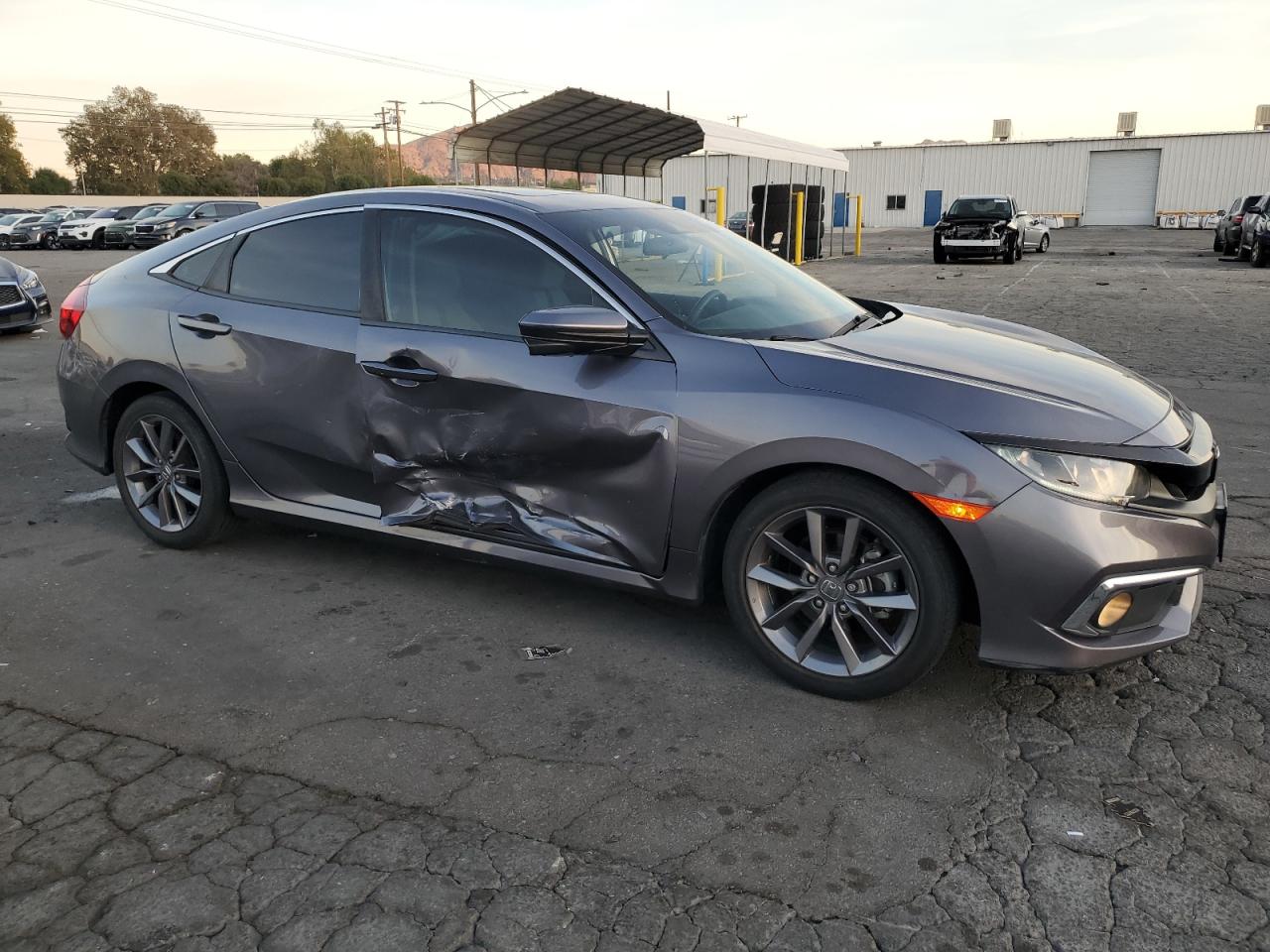 2020 Honda Civic VIN 19XFC1F39LE221620 Copart auction photo, side damage thumbnail 4