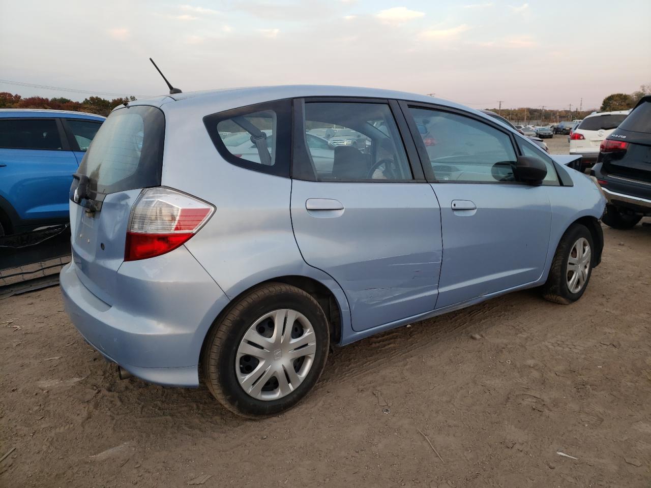 2009 Honda Fit VIN JHMGE88299S032529 Copart auction photo, all over damage thumbnail 3