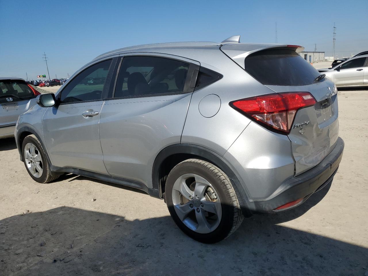 2016 Honda HR-V VIN 3CZRU5H7XGM719008 Copart auction photo, side / rear end damage thumbnail 2
