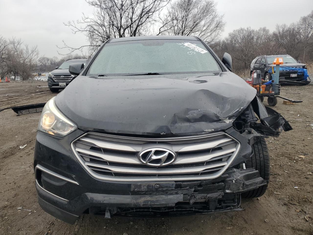 2017 Hyundai Santa Fe VIN 5NMZTDLB8HH020382 Copart auction photo, front end / minor dent/scratches damage thumbnail 5