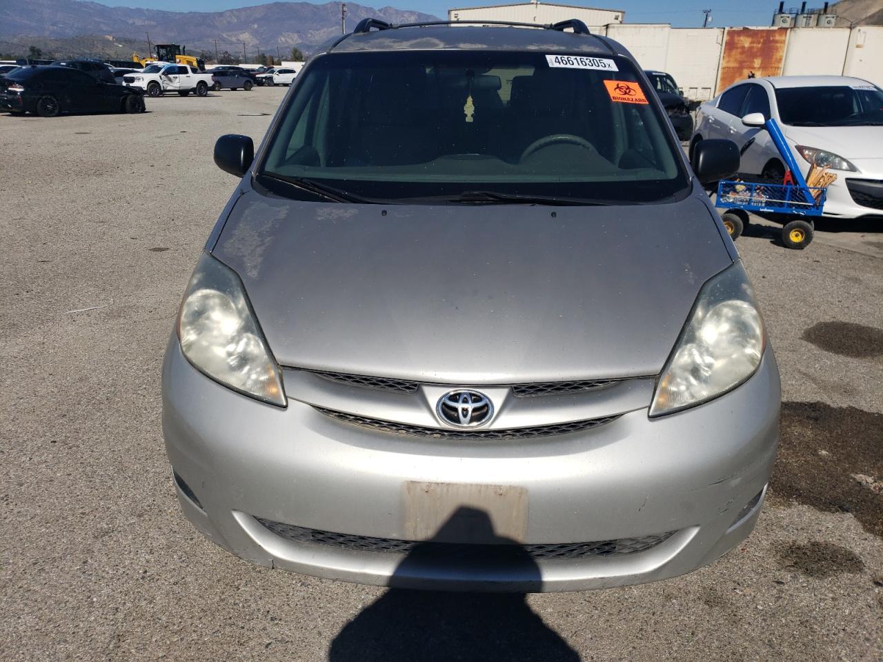 2010 Toyota Sienna VIN 5TDKK4CCXAS312227 Copart auction photo, minor dent/scratches damage thumbnail 5