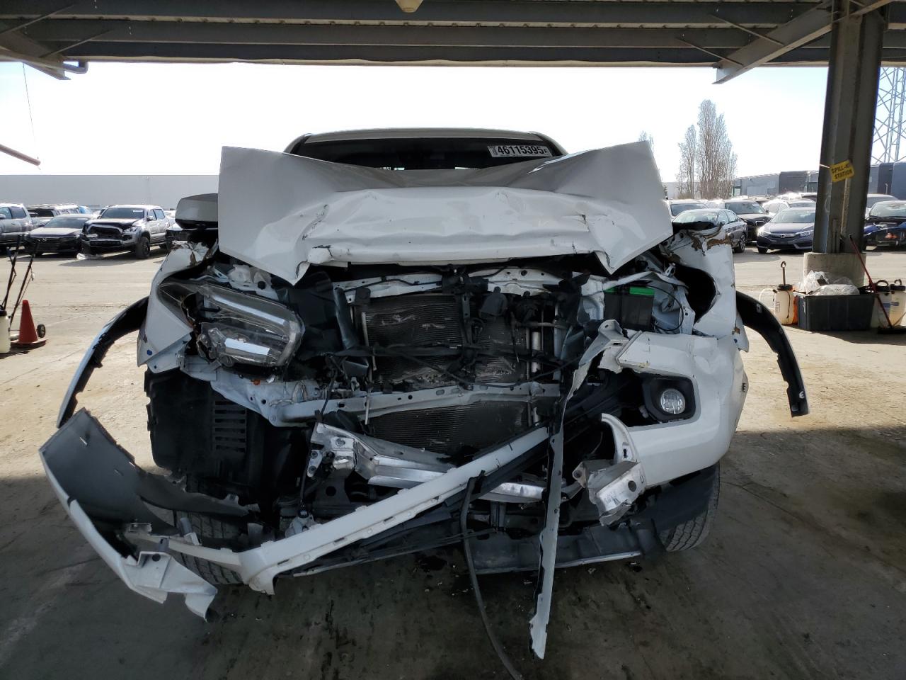 2021 Toyota Tacoma VIN 3TMDZ5BN2MM099324 Copart auction photo, front end damage thumbnail 5
