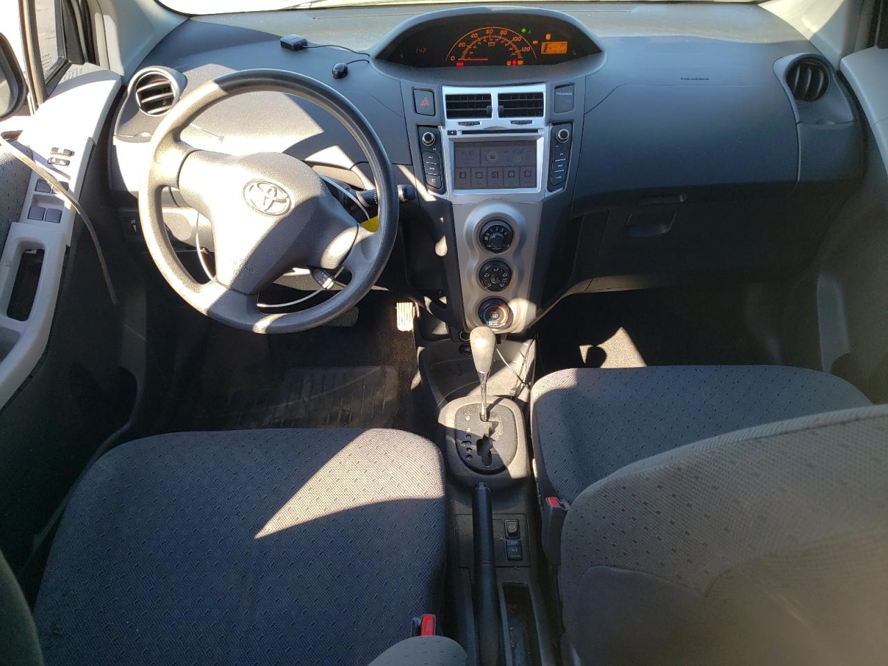 2011 Toyota Yaris VIN JTDKT4K32B5342621 Copart auction photo, side / front end damage thumbnail 8