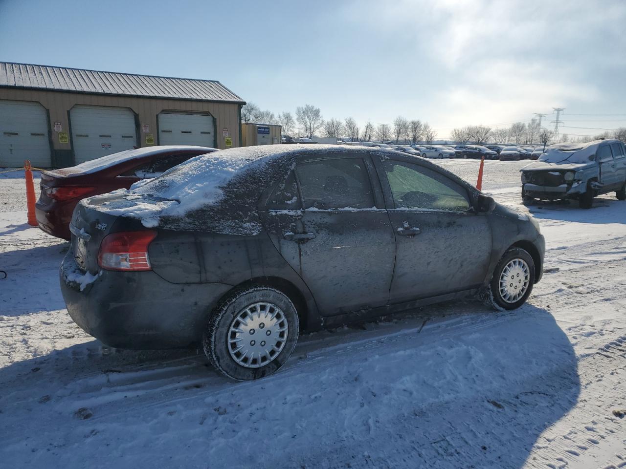 2009 Toyota Yaris VIN JTDBT903391303697 Copart auction photo, side damage thumbnail 3