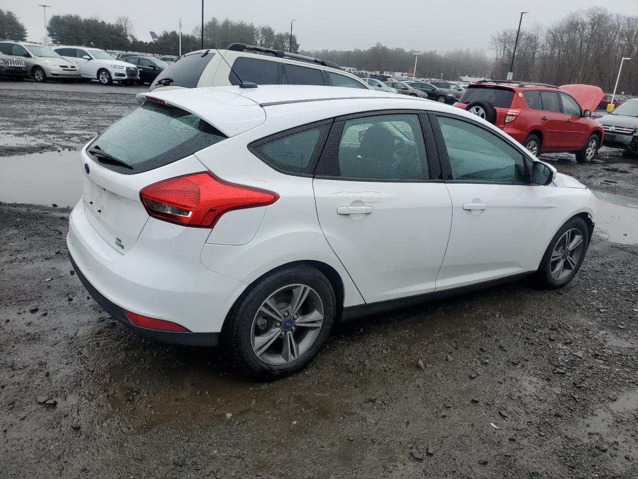 2016 Ford Focus VIN 1FADP3KEXGL303972 Copart auction photo, front end / minor dent/scratches damage thumbnail 3