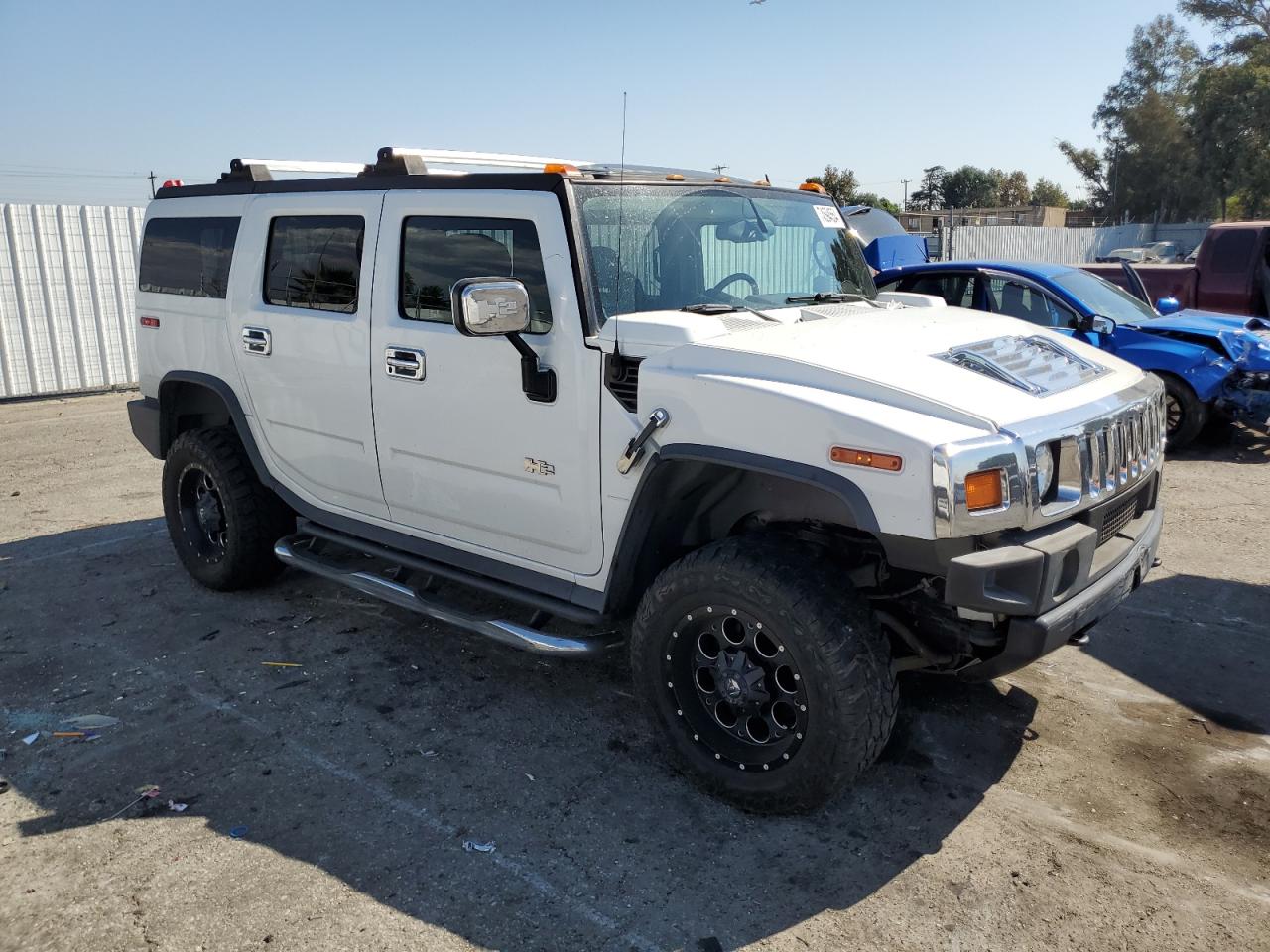 2005 Hummer H2 VIN 5GRGN23U35H132428 Copart auction photo, front end / minor dent/scratches damage thumbnail 4