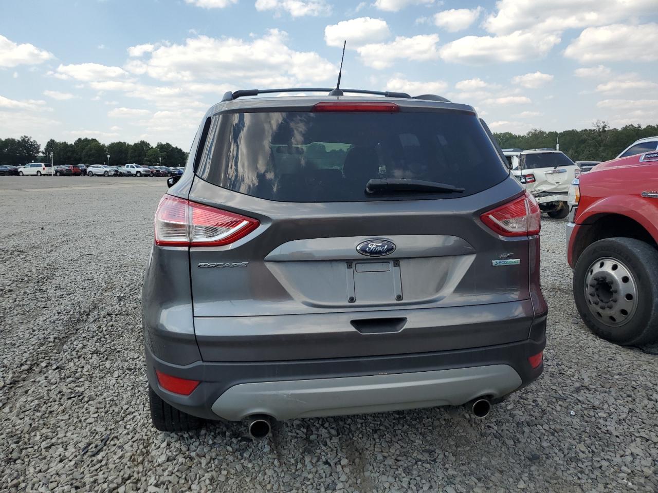 2013 Ford Escape VIN 1FMCU0GX9DUB39381 Copart auction photo, burn / minor dent/scratches damage thumbnail 6