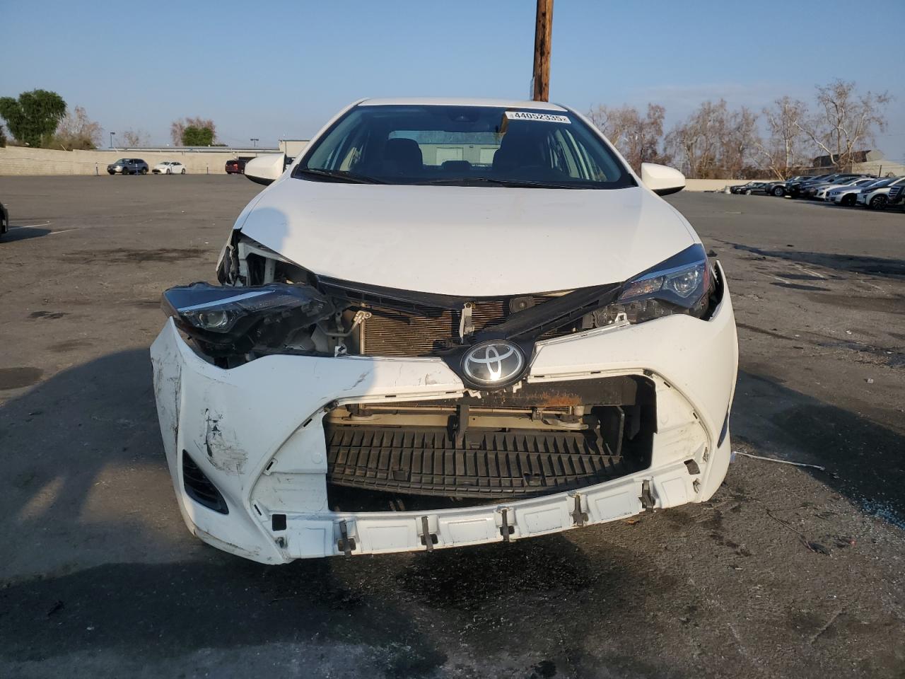 2019 Toyota Corolla VIN 5YFBURHE3KP868083 Copart auction photo, front end / side damage thumbnail 5