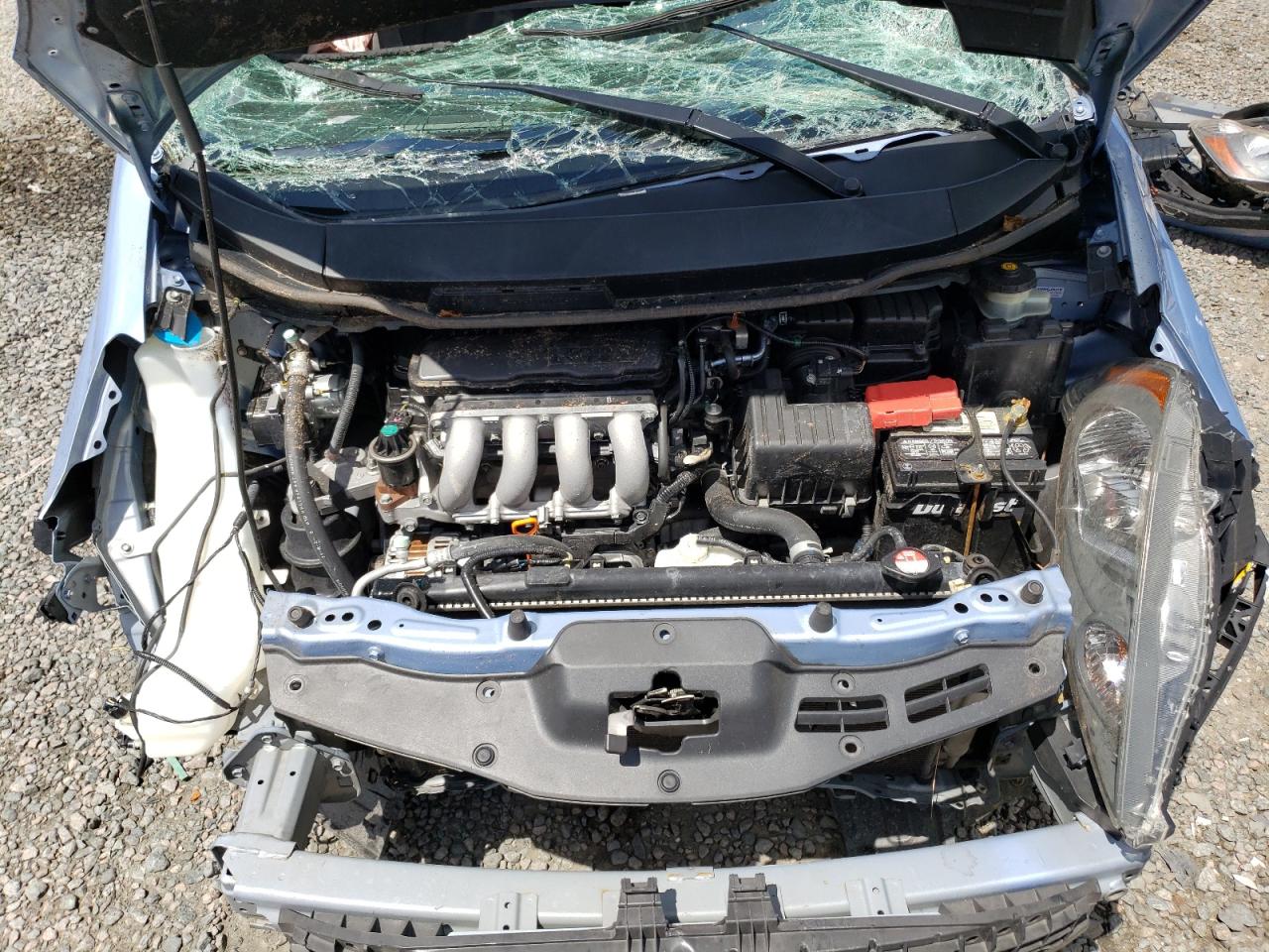 2010 Honda Fit VIN JHMGE8H25AC027164 Copart auction photo, all over damage thumbnail 11