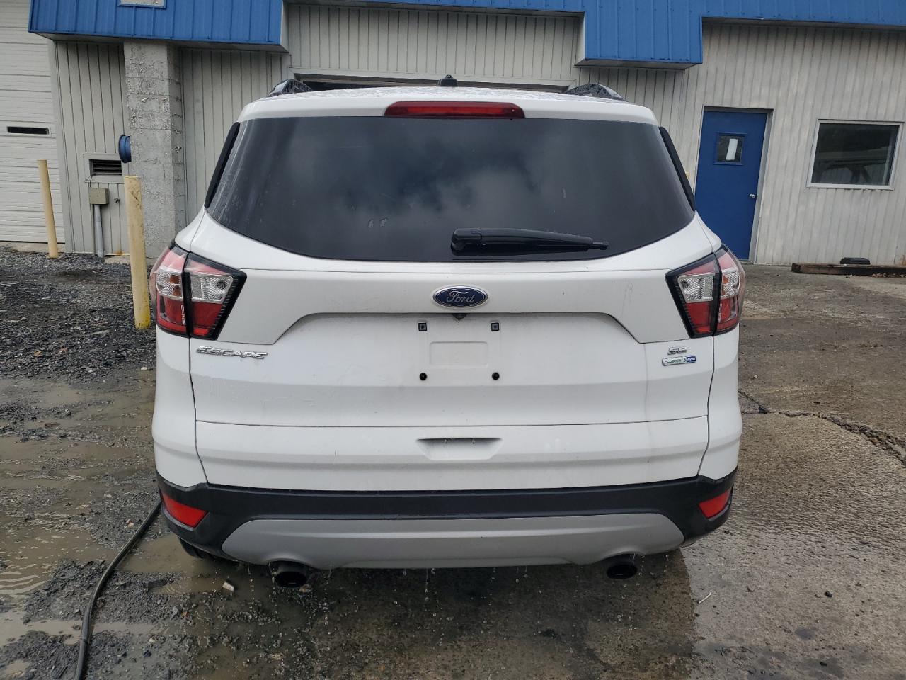 2018 Ford Escape VIN 1FMCU9GD5JUC76971 Copart auction photo, minor dent/scratches damage thumbnail 6