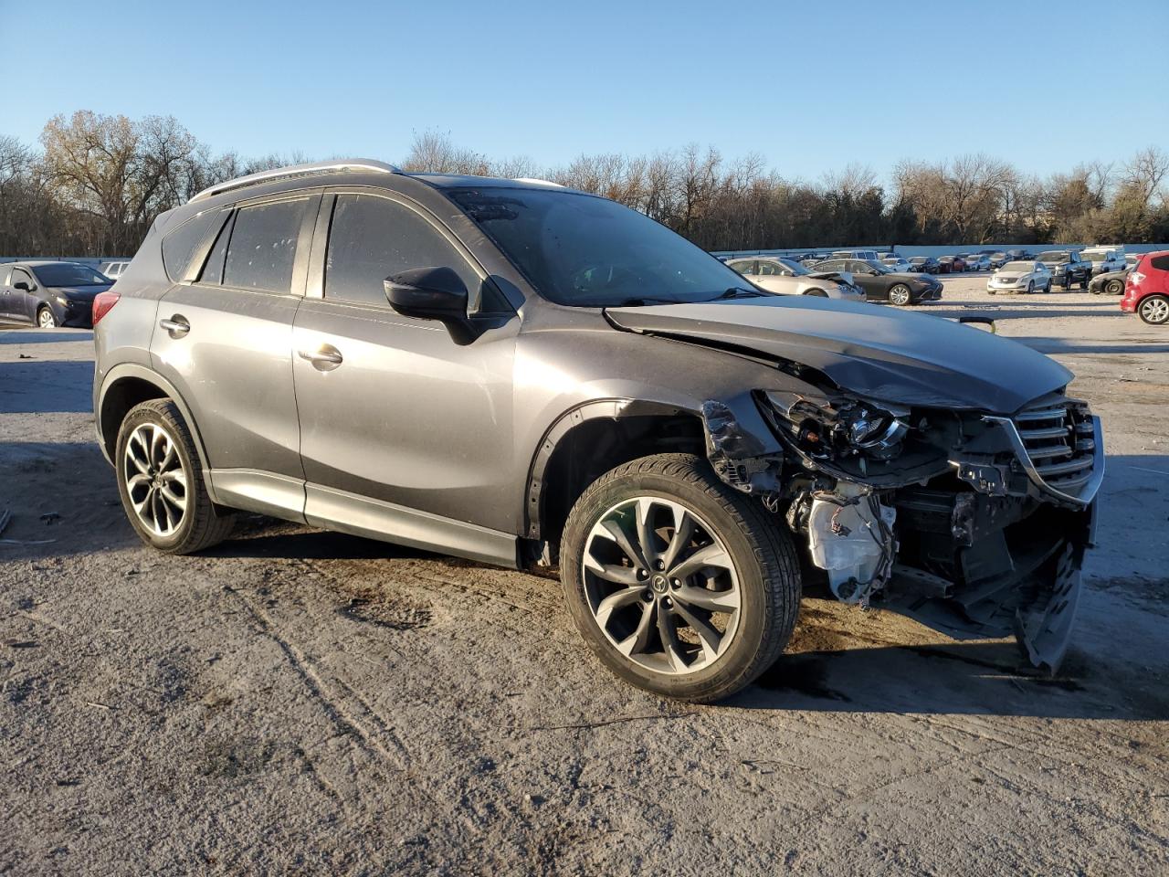 2016 Mazda CX-5 VIN JM3KE2DY5G0621094 Copart auction photo, front end / minor dent/scratches damage thumbnail 4