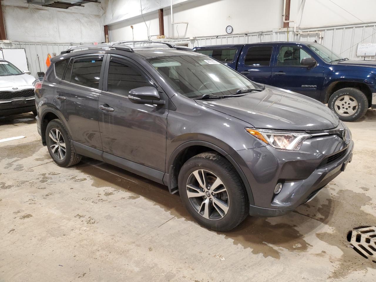 2018 Toyota RAV 4 VIN 2T3RFREV8JW848445 Copart auction photo, side damage thumbnail 4