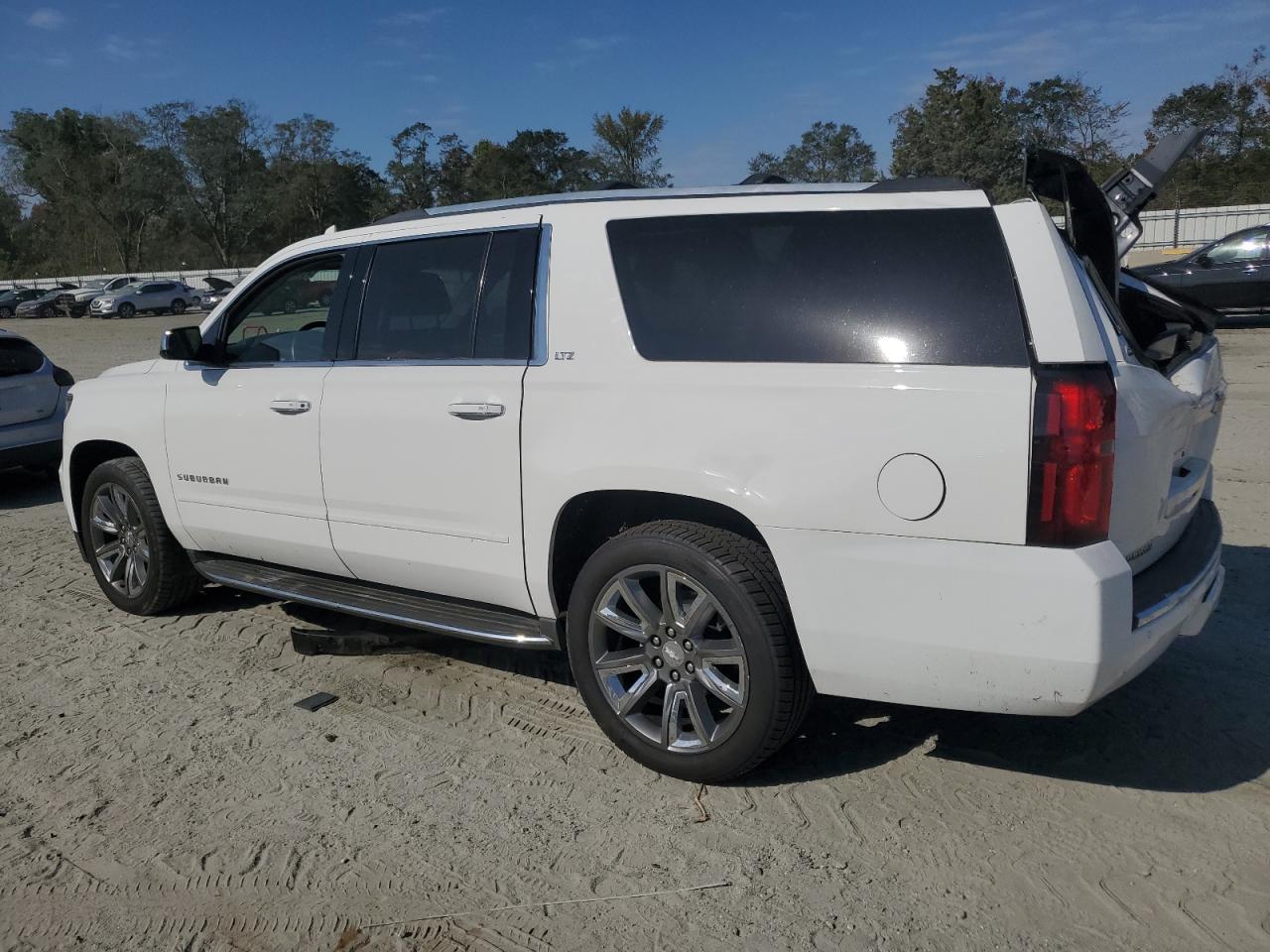 2015 Chevrolet Suburban VIN 1GNSKKKC0FR631381 Copart auction photo, water/flood damage thumbnail 2