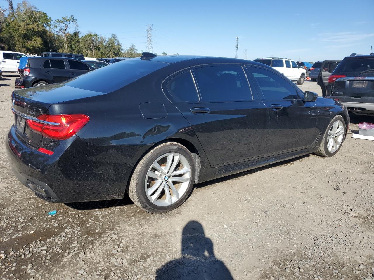 2016 BMW 7er VIN WBA7F0C5XGGL99549 Copart auction photo, rear end / side damage thumbnail 3