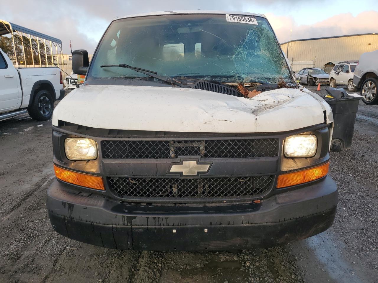 2012 Chevrolet Express VIN 1GCWGFCB9C1117578 Copart auction photo, top/roof damage thumbnail 5