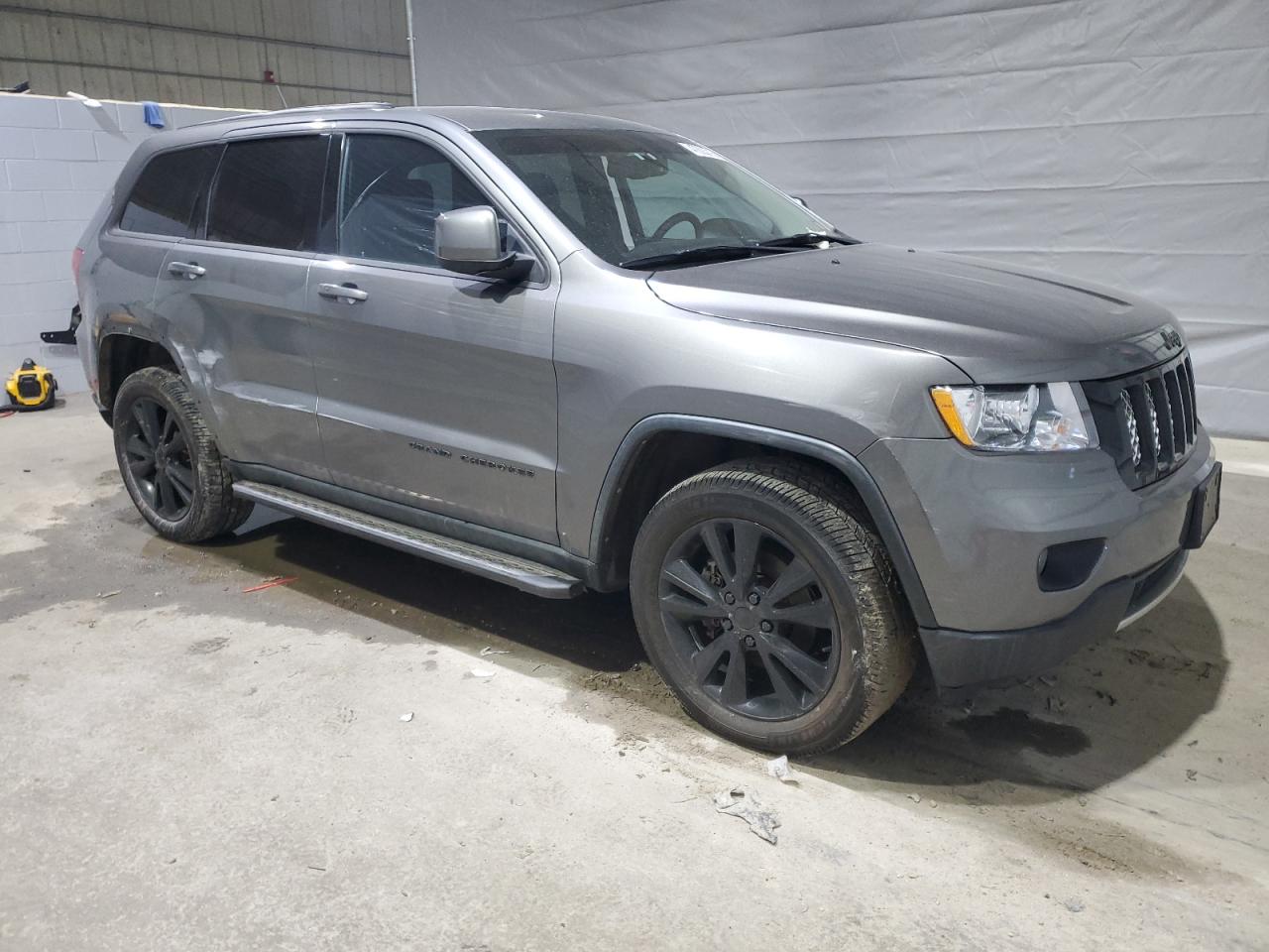 2012 Jeep Grand Cherokee VIN 1C4RJFAT4CC353523 Copart auction photo, front end / side damage thumbnail 4