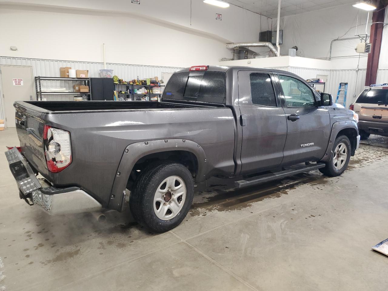 2014 Toyota Tundra VIN 5TFRM5F14EX074142 Copart auction photo, rear end / undercarriage damage thumbnail 3