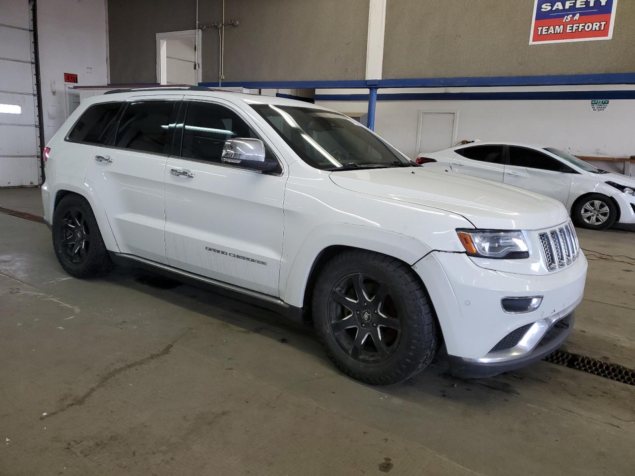 2014 Jeep Grand Cherokee VIN 1C4RJFJM0EC333653 Copart auction photo, undercarriage damage thumbnail 4