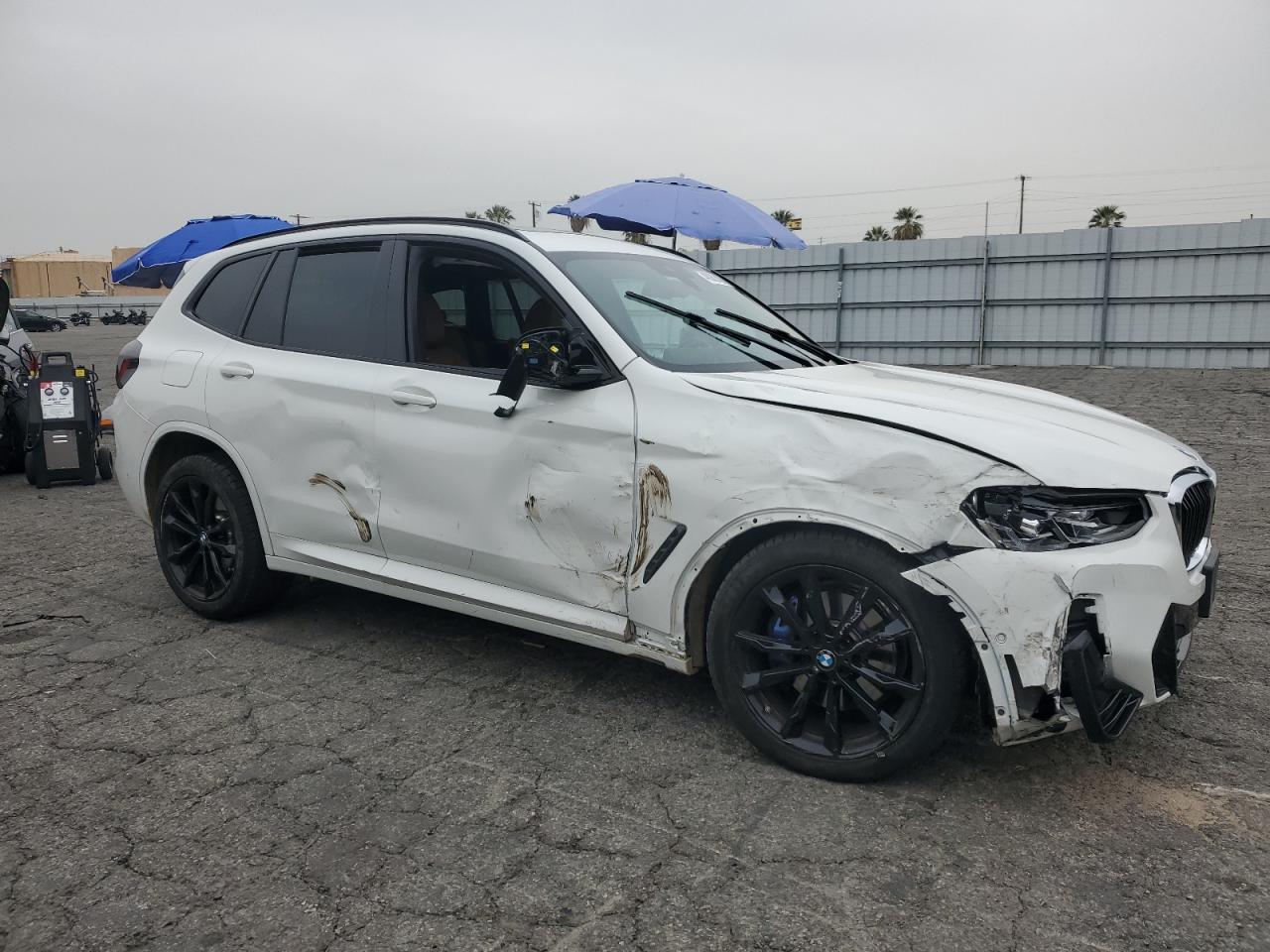 2022 BMW X3 M VIN 5UX83DP06N9L10338 Copart auction photo, side / front end damage thumbnail 4